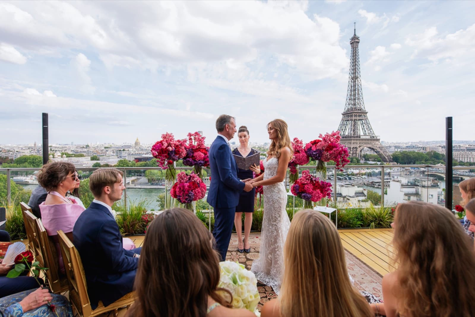 Intimate rooftop wedding ceremony with an Eiffel Tower view in Paris by SabShots