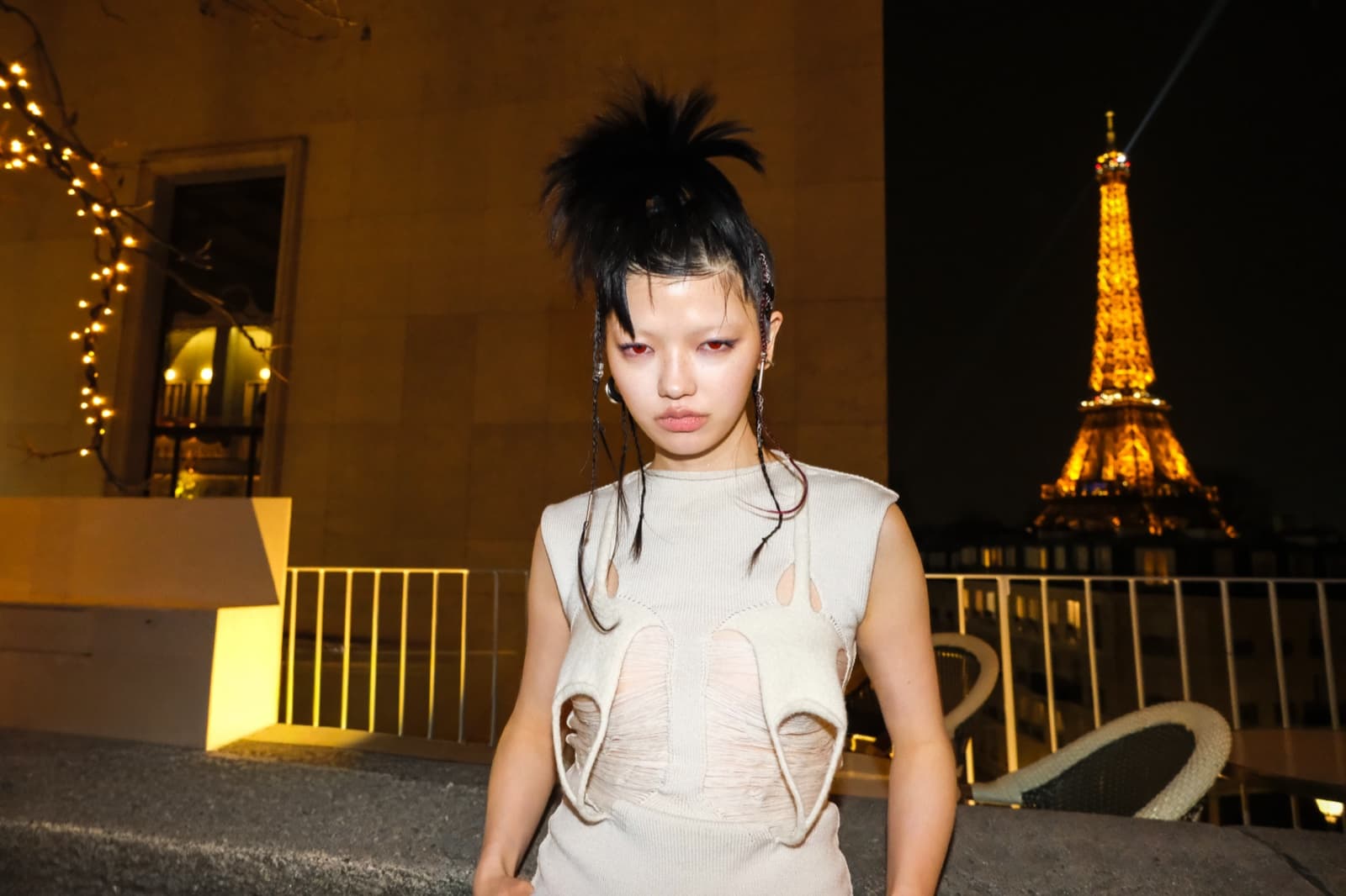 Edgy fashion portrait with the illuminated Eiffel Tower at night, a dreamy instagrammable Paris shot by SabShots